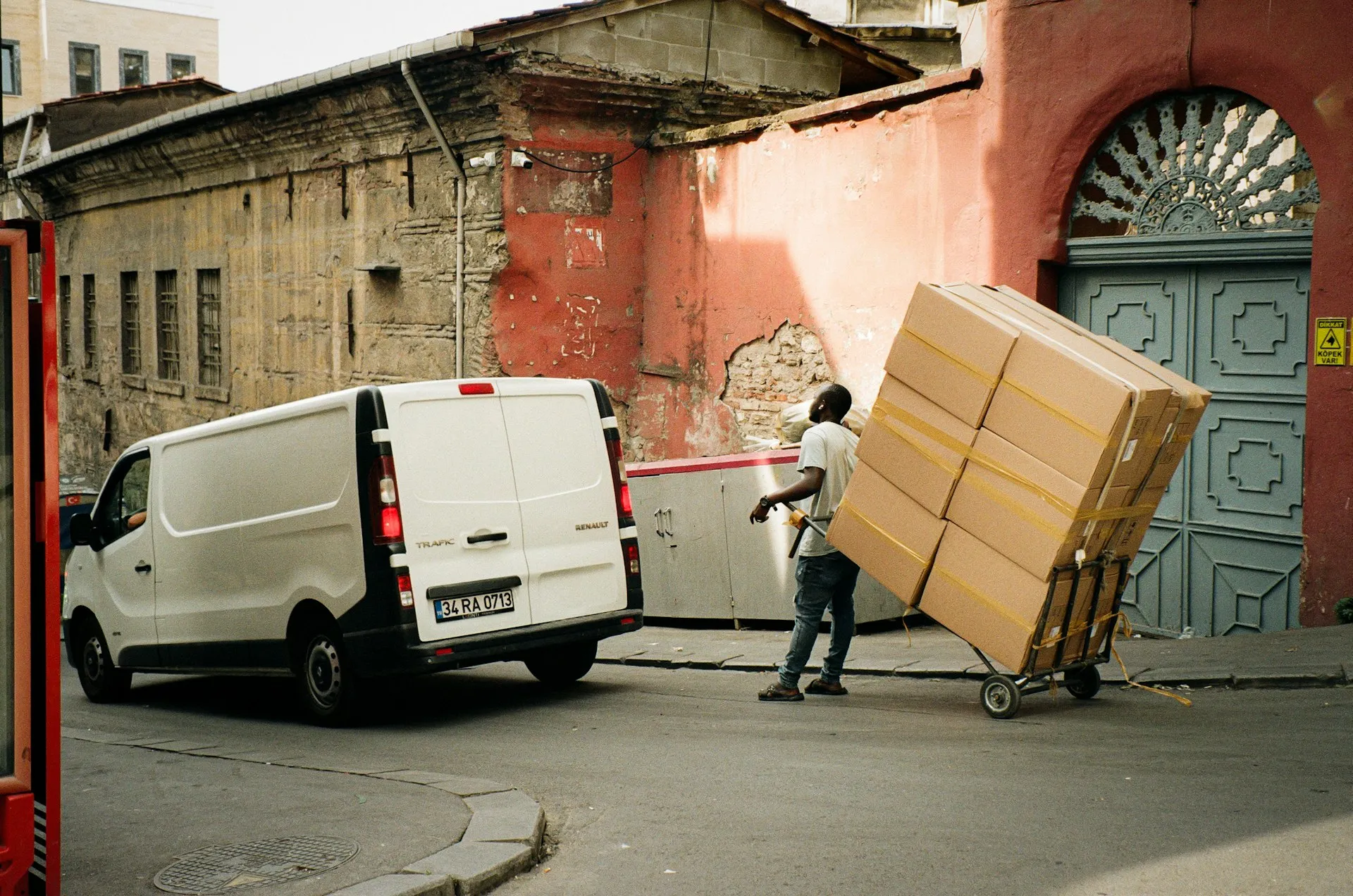 Man loading boxes into a clearance van